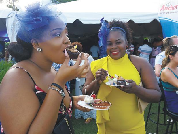 Deborah Bartlett (left) and Connie Drayton enjoyed some of the delectable dishes at the Taste of the Spirits Polo event held yesterday evening.