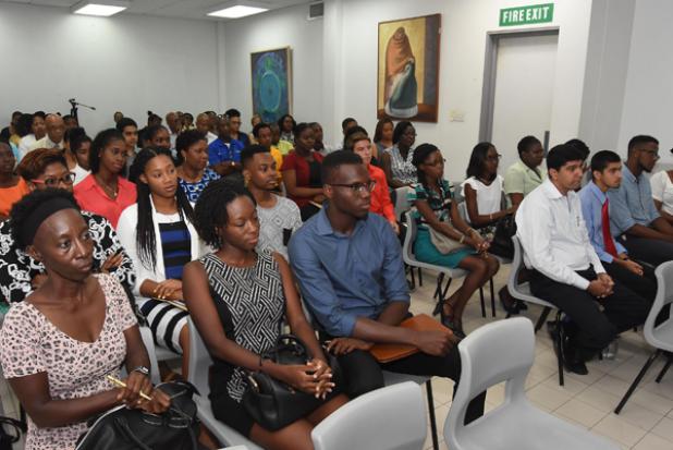 The 2016 Scholarship and Exhibition awardees and their parents during a meeting held at the Ministry of Education’s headquarters yesterday.  