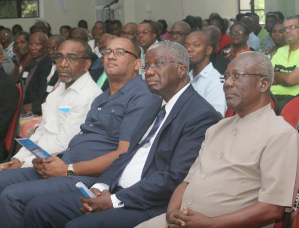 FROM LEFT: Minister of Energy Senator Darcy Boyce; Minister of Tourism Richard Sealy; Prime Minister Freundel Stuart; and Former BWU General Secretary Sir Roy Trotman paying close attention to the speakers. 