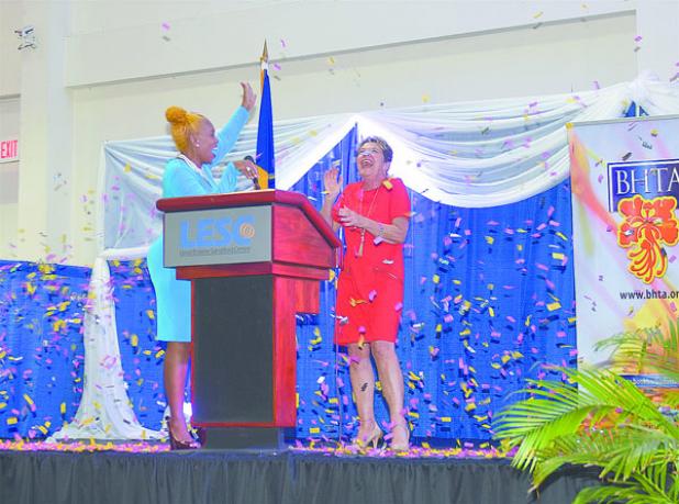 Chairman of the Barbados Hotel and Tourism Association (BHTA), Roseann Myers (left), leading the tribute to outgoing Chief Executive Officer (CEO), Susan Springer, who officially leaves the post on December 16. The tribute came during the BHTA’s fourth quarterly general meeting at the Lloyd Erskine Sandiford Centre yesterday. 