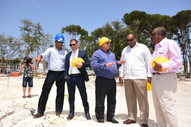 Chairman of Sandals Resorts International, Gordon ‘Butch’ Stewart (centre) had the full attention of Minister of Tourism and International Transport, Richard Sealy (second from right); and Minister of Health and Member of Parliament for Christ Church South, John Boyce (right), after the groundbreaking ceremony for the Sandals expansion project. Also pictured on site is Terence Des Vignes (left), Senior Project Manager for Sandals Resorts International, and CEO of Sandals Resorts International, Adam Stewart.