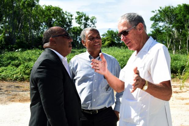 Minister of Agriculture, Food, Fisheries and Water Resource Management, Dr. David Estwick (left) chatting with Chairman of Williams Industries Limited, Ralph ‘Bizzy’ Williams (right) and Deputy Chairman of the BWA, Henry Barrow.