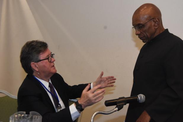 FROM LEFT: Executive Director, World Bank Group Alister Smith talking to Central Bank Governor Dr. Delisle Worrell at the opening of the Central Bank of Barbados’ 36th Annual Review Seminar at the Accra Beach Resort and Spa yesterday.      