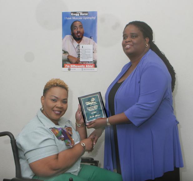 President of the Senate, Senator Kerryann Ifill (right) presenting the 12th Annual Kregg Nurse Memorial Scholarship Award 2016 to the winner, Janelle Skinner, at the presentation ceremony held recently at the Caribbean Catalyst office in River Road.