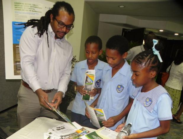 Nicholas Grainger, Deputy Director at CARIBSAVE, shares with students some of the work his  organisation has been doing, during the recent Green Knowledge Fair held at the Lloyd Erskine Sandiford Centre.