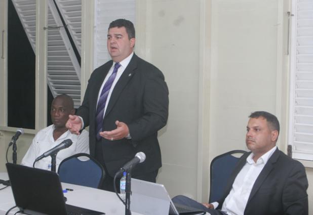 Chief Financial Officer of the Deltro Group, Dean Del Mastro speaking about the solar farm, while (at left) Managing Director of MAG Construction Mark Griffith and Registered Engineer Omar Alahar listen. 