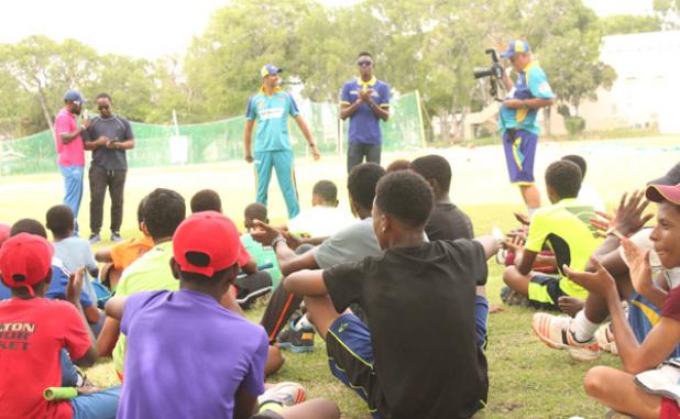The young players listening intently to David Wiese and Shamar Springer as they share words of wisdom on the game during yesterday’s session at the Cric-mechanics Camp at Wanderers.   
