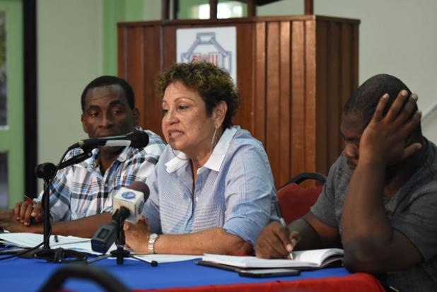 President of the BSTU, Mary-Ann Redman (centre) addressing the meeting yesterday, flanked by Erskine Padmore (left) First Vice President of the BSTU and General Secretary, Andrew Brathwaite.