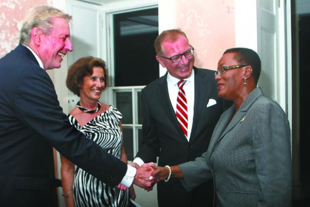 Honorary Consul General of the Republic of Poland in Barbados, Michael Armstrong (left) greets Minister of Foreign Affairs and Foreign Trade, Senator Maxine McClean (right) before introducing her to the Ambassador of the Republic of Poland to Barbados, Piotr Kaszuba (second right) and his wife, Anna Kaszuba (second left) recently at the Inauguration Function of the Consulate General of Poland at the George Washington House.