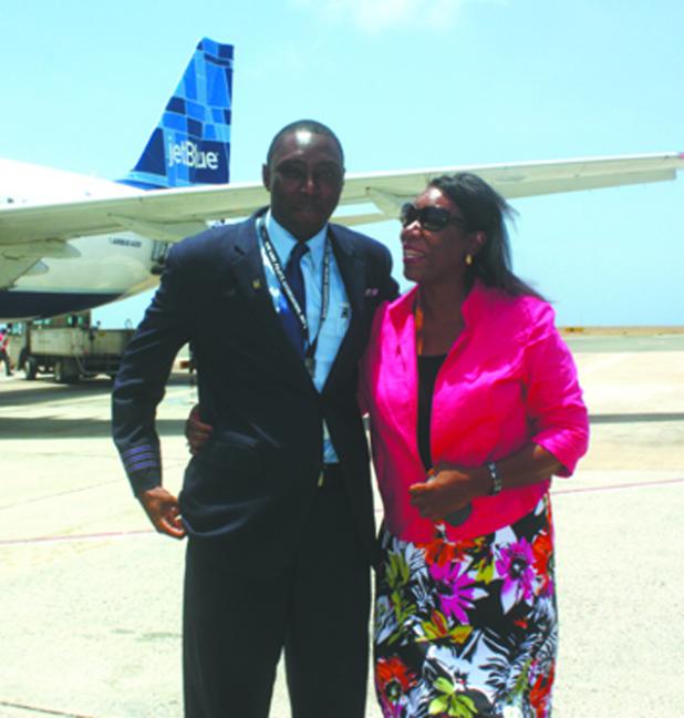 Jet Blue First Officer Wayne Mayers (left) was greeted by his mother Cynthia Mayers after the arrival of the inaugural non-stop service from Fort Lauderdale to Barbados at the Grantley Adams International Airport yesterday.