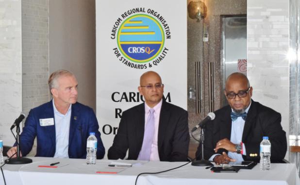 From Left: CEO of ICC Dominic Sims, CEO of CROSQ Deryck Omar and Planner with the NHC Raymond Lorde at Friday’s conference.