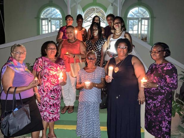 Members of Soroptimist International of Barbados and Soroptimist International of Jamestown held a candlelight vigil as a tribute and in memory of the victims and survivors of domestic and gender-based violence. 