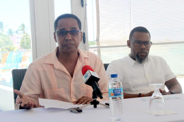Barbados’ Ambassador to the CARICOM, David Commissiong addressing the presentation at Sea Breeze Beach House on Friday while Executive Director of CDEMA, Ronald Jackson listens on.