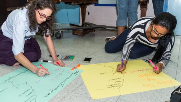 These Ecuadorian students were busy making placards to highlight the grim reality being faced in their homeland, after a 7.8 magnitude earthquake hit on Saturday night.  