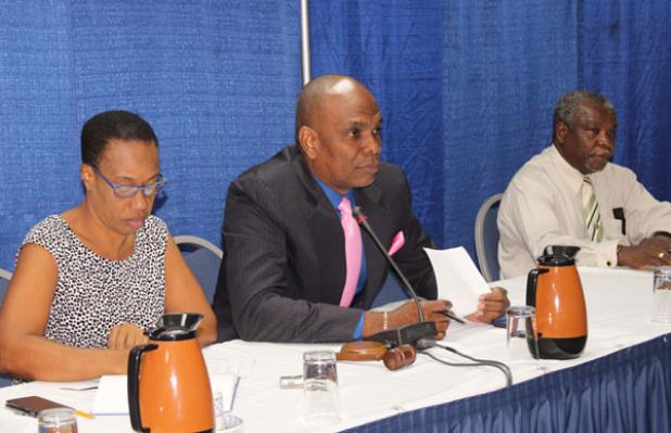 Timothy Nicholls (centre), 1st Vice President of the Barbados Association of Insurance and Financial Advisors (BARAIFA), sits with treasurer, Trevor Mapp (right) and secretary, Wendy Norville, during the opening of the conference.