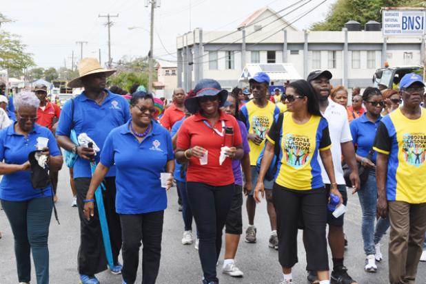 Minister of Labour, Senator Dr. Esther Byer-Suckoo (fourth from right), taking part in the Annual May Day march alongside General Secretary of the Barbados Workers Union, Toni Moore (centre); BWU President, Linda Brooks (third from right); BWU Assistant General Secretary, Dwaine Paul (second from left); BSTU General Secretary, Andrew Brathwaite and other union officials yesterday.