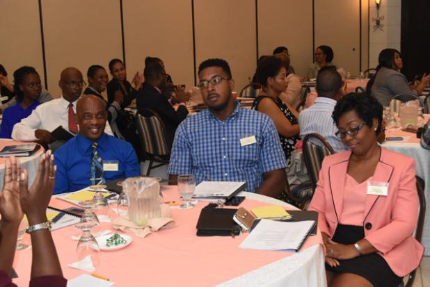 Some of the participants in attendance at the One Day Sensitisation Workshop on Competition Law yesterday at the Savannah Hotel. INSET: Minister of Industry, International Business, Commerce and Small Business Development, Donville Inniss.