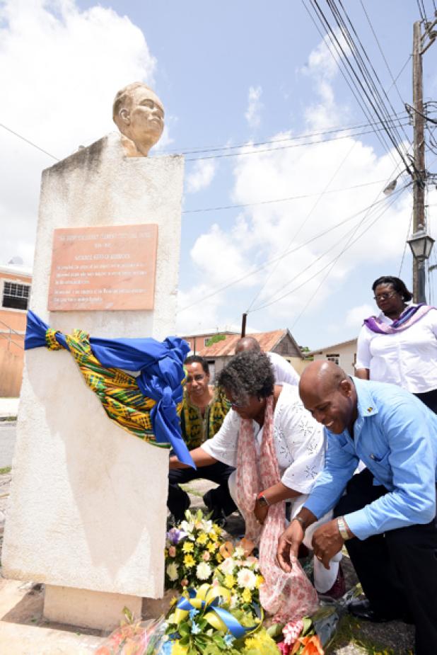 Leader of the Opposition, Mia Mottley (centre), lays a wreath while St. James North MP, Edmund Hinkson (right); President of the Clement Payne Movement, David Comissiong and Executive Assistant to the Leader of the Opposition, Pat Parris looks on.