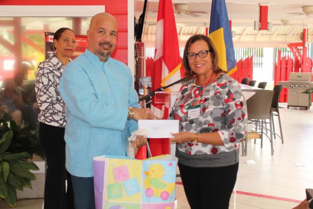 CWC Community Services Chair, Ann Smith, presents a disbursement cheque to Dr. Clyde Cave, who accepted the donation on behalf of the Queen Elizabeth Hospital’s Department of Paediatrics.