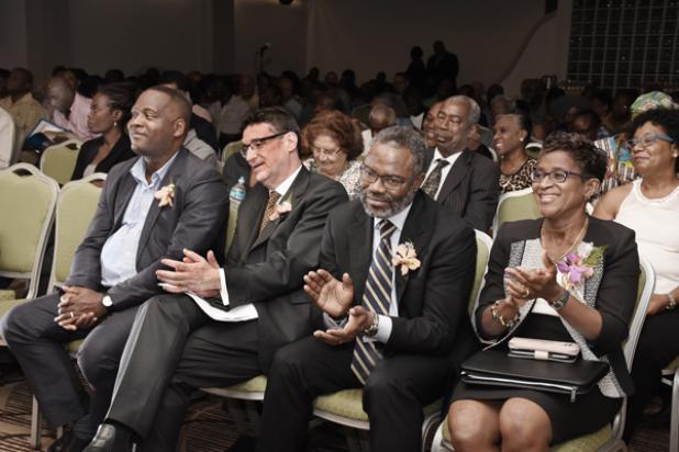 From Left: Minister of Industry, International Business, Commerce and Small Business Development, Donville Inniss; John Davies, Senior Vice President at Compass Lexecon; FTC Chairman Jefferson Cumberbatch; and Sandra Sealy, CEO of the Fair Trading Commission. 