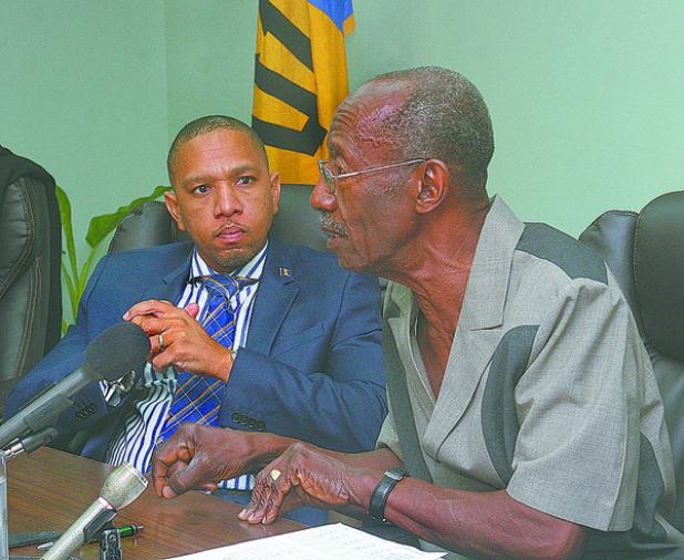 Chairman of the Financial Services Commission (FSC), Sir Frank Alleyne (right) making a point during the press conference. Looking on is Chief Executive Officer of the FSC, Randy Graham.