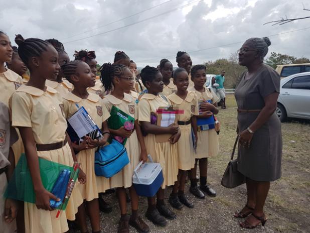 Hill Top teacher, Sharant Ramsay (right), giving her students advice yesterday morning, before they made their way through the gates of Combermere school to sit the Barbados Secondary Schools' Entrance Examination.