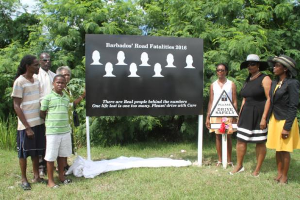 From right: BRSA volunteer, Paulavette Atkinson, with BRSA President and family members of those who lost loved ones in road fatalities, including Sharon Straughn and (from left) Nicholas Noel, his son Donae Noel and mother Judith Noel, during the unveiling of a sign to remember the lives lost this year on the highways and byways of Barbados. 