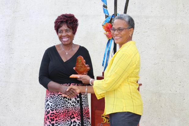 Cynthia Ottley accepting her award from Member of Parliament for St. John, Mara Thompson, during the St. John Community Awards on Saturday.