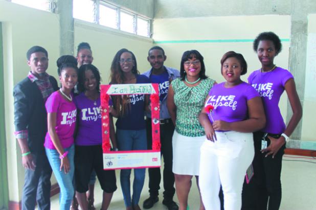 Mass Communication students posing for a picture with guest speaker, Melinda Belle of Image up by Melinda, during yesterday’s launch of the ‘I Am Beautiful’ Campaign.
