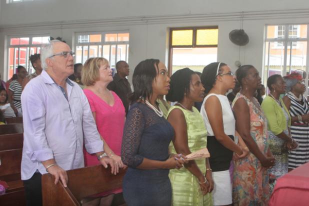 Some of the members of the new Board of the Young Women's Christian Association (YWCA) of Barbados and their family in attendance at the Mount Olive United Church of America church service yesterday. INSET: Minister Seon McKend.