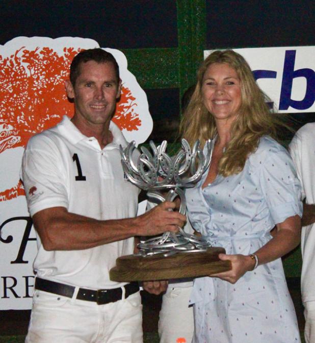 ICBL Team Captain, Richard Gooding, accepting the trophy from sister, Anikka Povey, after taking the Memorial 7-3.