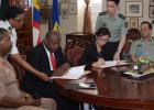 Permanent secretary (Ag) Division of Defence and Security, Timothy Maynard (second left), and Ambassador for the People’s Republic of China, Her Excellency Wang Ke, during the official signing of an agreement that will see the provision of military aid from the People’s Liberation Army to Barbados, while Chief of Staff of the BDF, Colonel Alvin Quintyne (left), and Major General Hu Changming (right) Deputy Chief, Office for Military Co-operation, Ministry of National Defence of China, look on.