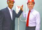 National Hero and Digicel Brand Ambassador, the Right Honourable Sir Garfield Sobers (left) and Chief Executive Officer of Digicel Barbados, Conor Looney switching on the Digicel LTE network.   