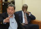 Chairman of LIAT’s Shareholder Board, Prime Minister of St. Vincent and the Grenadines, Dr. Ralph Gonsalves (left) makes a point during a press conference yesterday while Prime Minister, the Right Honourable Freundel Stuart looks on.