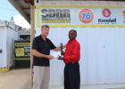  Reggie Gill from SDRR is seen here presenting President of the BBCA Glyne Greaves with their contribution to the trip to Trinidad.  
