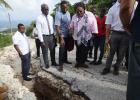 Prime Minister Mia Amor Mottley (centre) looking into the wide hole at Pothouse St. John, alongside St John M.P. Charles Griffith and Minister of Water Resources and Energy Wilfred Abrahams.