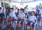 Students of the Winsor High School enjoying the newly donated chairs to the Eunice Gibson Polyclinic. 
