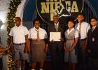 Members of the Coleridge and Parry School Choir accept their two NIFCA gold awards and three Incentive awards from Prime Minister, the Hon. Freundel Stuart.