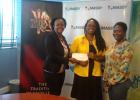 From left, Public Relations Officer of Massy, Jennifer Branch, presents the sponsorship cheque for NIFCA Massy Creators' Awards to Chief Cultural Officer of NCF, Andrea Wells and Dance Cultural Officer of NCF, Alicia Payne-Hurdle.