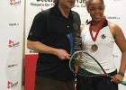 Meagan Best (right) being presented with her GU-15 trophy by a Squash Canada representative.
