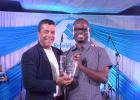 Elroy Yearwood, winner of the Managing Director’s Spirit of Republic Award Grades 1-10, accepting his award from MD & CEO, Ian De Souza.